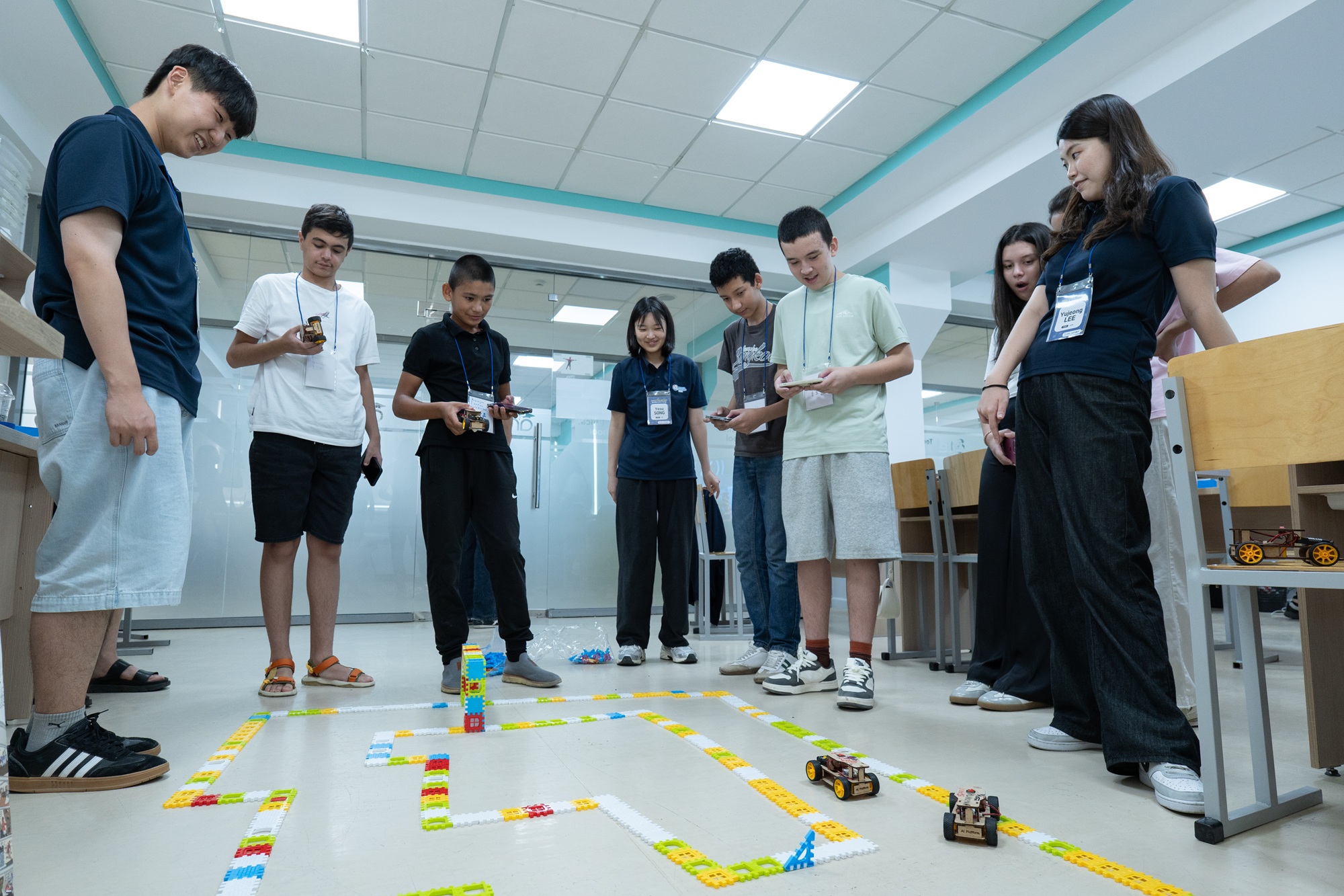 Students in Tashkent tested their autonomous vehicles during a hands-on STEM session with UNIST student volunteers.